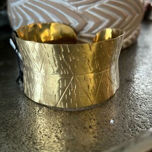 Gold cuff bracelet with etchings
